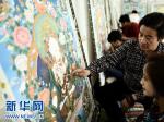 热贡艺术产业带动藏族群众致富增收