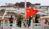 3月28日，西藏自治区拉萨布达拉宫广场举行升国旗唱国歌仪式，纪念西藏百万农奴解放五十七周年。 中新社记者 李林 摄