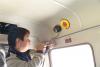 中国移动工作人员在尼木县教育局校车里安装校车安全监控设备，通过信息化手段实现校车动态监控。