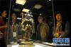 9月12日，观众在珍宝馆观看布达拉宫精品文物展上展出的佛像。