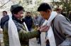 2月17日，在联欢活动现场，维吾尔族青年阿卜杜力艾则（左）与藏族青年互献哈达以示祝福。