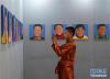 7月13日，在北京民族文化宫，一名来自辽阳市第一中学西藏班的学生在展览上参观拍照。新华社记者 申宏 摄