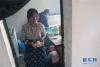7月18日，甘肃省甘南藏族自治州碌曲县尕海乡尕秀村村民拉姆措在自家“牧家乐”内为游客准备藏餐。新华社记者 陈斌 摄