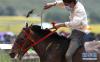 7月30日，一名牧民骑手在比赛中。新华社记者江宏景摄