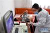 8月7日，在西藏山南市错那县勒门巴民族乡卫生室，医护人员用B超为体检者进行检查。新华社记者 晋美多吉 摄