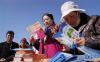 3月24日，拉萨市民在活动现场了解疾病防控知识。当日是第23个“世界结核病防治日”。新华社记者 晋美多吉 摄