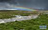 西藏日喀则市定日县出现雨后彩虹（7月24日摄）。
