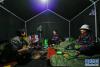 在西藏林芝市墨脱镇玛迪村临时救灾安置点，村民在帐篷中吃晚饭（10月20日摄）。新华社记者 刘东君 摄