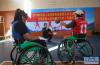 10月27日，中国残疾人体育运动管理中心轮椅篮球项目专员薛亮（中）在对西藏轮椅篮球队的队员进行预分级。新华社记者 晋美多吉 摄