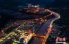 图为7月29日，俯瞰夜幕下的昌都市区。 中新社记者 何蓬磊 摄