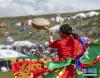 8月7日，在西藏首届弦子舞展演现场，演出人员在表演舞蹈《弦鼓情缘》。