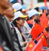 8月19日，群众代表参加庆祝西藏和平解放70周年大会。新华社记者 晋美多吉 摄