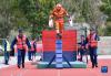 9月15日，消防队员在进行100米消防障碍课目比赛。新华社记者 晋美多吉 摄