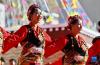 12月10日，在西藏康马县2021年产业竞赛暨冬季物资交流会开幕式上，来自拉孜县的演员在表演节目。新华社记者 张汝锋 摄