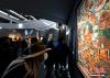 12月19日，西藏拉萨，观众正在欣赏展览中的唐卡。