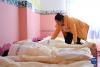 9月4日，青海省果洛藏族自治州玛沁县大武幼儿园园长孙香兰在照顾孩子们午睡。